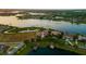 Stunning aerial view of a grand estate by the lake at sunset at 14645 Isleview Dr, Winter Garden, FL 34787