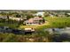 Expansive aerial view showcasing the waterfront property with a pool and private dock at 14645 Isleview Dr, Winter Garden, FL 34787