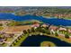 Aerial view of waterfront property with a prime location and nearby amenities at 14645 Isleview Dr, Winter Garden, FL 34787
