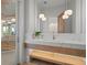Modern bathroom with designer lighting and a bright white color palette at 14645 Isleview Dr, Winter Garden, FL 34787