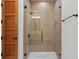 Modern shower with glass enclosure, rainfall showerhead, and sleek hardware for a spa-like experience at 14645 Isleview Dr, Winter Garden, FL 34787