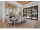 Elegant dining room featuring a large table, seating for six, and sliding glass doors to the outdoor pool and patio area at 14645 Isleview Dr, Winter Garden, FL 34787