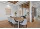 Spacious dining room with seating for eight, modern decor, and stylish accents at 14645 Isleview Dr, Winter Garden, FL 34787