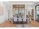 Open dining area with a large table, seating, and natural light at 14645 Isleview Dr, Winter Garden, FL 34787