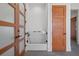 Convenient pet washing station complete with subway tile, black hardware, and easy access doors at 14645 Isleview Dr, Winter Garden, FL 34787