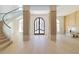 Bright foyer showcasing a spiral staircase, wood floors, and a view of the front entrance at 14645 Isleview Dr, Winter Garden, FL 34787