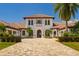 Stunning two-story home with a tile roof and manicured landscaping at 14645 Isleview Dr, Winter Garden, FL 34787
