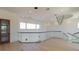 Hallway with a modern chandelier, glass railings, and a view of the outdoors at 14645 Isleview Dr, Winter Garden, FL 34787