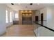 Bright hallway with hardwood floors, built-in shelves, and arched windows providing natural light at 14645 Isleview Dr, Winter Garden, FL 34787