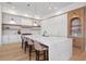 Bright kitchen featuring modern appliances, a large island, and barstool seating at 14645 Isleview Dr, Winter Garden, FL 34787