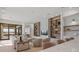 Open concept living area with shelving, comfortable seating, and access to outdoor living at 14645 Isleview Dr, Winter Garden, FL 34787