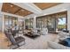 Open concept living room with high ceilings, a fireplace, and access to the dining area and pool area at 14645 Isleview Dr, Winter Garden, FL 34787