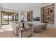 Bright living room with sliding doors, hardwood floors, and stylish decor at 14645 Isleview Dr, Winter Garden, FL 34787
