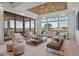 Bright and airy living room featuring comfortable seating, large windows, and scenic lake views at 14645 Isleview Dr, Winter Garden, FL 34787