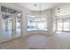 Bright living room featuring a bay window with a view of the pool and french doors at 14645 Isleview Dr, Winter Garden, FL 34787