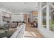Open-concept living space with hardwood floors and seamless flow to kitchen and dining areas at 14645 Isleview Dr, Winter Garden, FL 34787