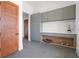 Well-organized mud room with gray custom cabinetry and a built-in dog bed cubby at 14645 Isleview Dr, Winter Garden, FL 34787