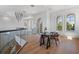 Office with ample natural light, a glass desk, and staircase access at 14645 Isleview Dr, Winter Garden, FL 34787