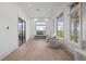 Bright office with a large window, comfortable seating, and modern decor at 14645 Isleview Dr, Winter Garden, FL 34787
