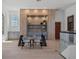 Well-lit home office with custom built-ins and a sleek glass desk at 14645 Isleview Dr, Winter Garden, FL 34787