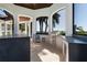 State-of-the-art outdoor kitchen, perfect for al fresco dining with ample counter space and high-end appliances at 14645 Isleview Dr, Winter Garden, FL 34787