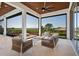 This is a scenic covered patio with panoramic views and comfortable seating that inspires relaxation at 14645 Isleview Dr, Winter Garden, FL 34787