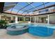 A stunning pool area with a luxurious spa and seamless transition between indoors and outdoors at 14645 Isleview Dr, Winter Garden, FL 34787