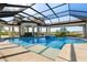 Breathtaking pool and spa, surrounded by elegant columns and a screened enclosure that has picturesque views at 14645 Isleview Dr, Winter Garden, FL 34787