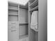 Well-organized walk-in closet with ample shelving, drawers, and hanging space for clothing and accessories at 14645 Isleview Dr, Winter Garden, FL 34787