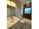 Bright bathroom with a tub, modern vanity, and quartz countertops at 15369 Sw 60Th Cir, Ocala, FL 34473