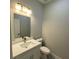 Powder room with a modern vanity, faucet and quartz countertops at 15369 Sw 60Th Cir, Ocala, FL 34473