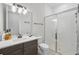 Bathroom with subway tile shower, modern fixtures, and a patterned tile floor at 16008 Volterra Pt, Montverde, FL 34756