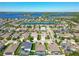 Expansive aerial view of a residential area featuring a mix of homes, water features, and lush greenery at 16084 Black Hickory Dr, Winter Garden, FL 34787