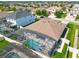 Aerial view of backyard pool area with full perimeter fence surrounded by houses at 16084 Black Hickory Dr, Winter Garden, FL 34787