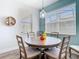 Cozy dining area with modern pendant lighting and large windows at 16084 Black Hickory Dr, Winter Garden, FL 34787