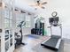 Functional exercise room with ceiling fan and natural light at 16084 Black Hickory Dr, Winter Garden, FL 34787