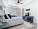 Comfortable main bedroom featuring a tray ceiling and neutral decor at 16084 Black Hickory Dr, Winter Garden, FL 34787