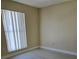 Bright bedroom with a large window and base trim at 1864 Caralee Blvd # 3, Orlando, FL 32822