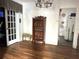 Dining room featuring a vintage display cabinet, wood floors, and an open doorway leading to another room at 1919 Waldo St, Orlando, FL 32806