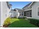 A view of the backyard showing the rear exterior of the property at 2090 Common Way Rd, Orlando, FL 32814