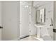 Well-lit powder room featuring a pedestal sink and toilet at 2090 Common Way Rd, Orlando, FL 32814