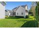 The home's rear exterior shows a screen porch and manicured backyard at 2090 Common Way Rd, Orlando, FL 32814