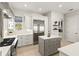 Well-equipped kitchen featuring a stainless steel refrigerator and center island at 2090 Common Way Rd, Orlando, FL 32814