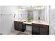 Modern bathroom featuring dual sinks, a vanity area, and a large mirror, creating a spa-like atmosphere at 2145 Rush Bay Way, Orlando, FL 32824