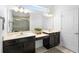 Bathroom featuring double sink vanity, large mirror, and modern fixtures, creating a bright and functional space at 2145 Rush Bay Way, Orlando, FL 32824