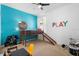 A fun bedroom with a loft bed, slide, and playful decor in a bright, cheerful space at 2145 Rush Bay Way, Orlando, FL 32824