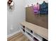 A practical mudroom with a storage bench and hooks for organizing shoes and backpacks at 2145 Rush Bay Way, Orlando, FL 32824