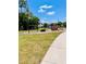 Community playground with swings, slides, and climbing structures set in a grassy area at 224 Meghan Cir, Deland, FL 32724