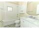 Well-lit bathroom featuring a marble vanity, stylish tiled floor, and a shower/tub combination at 2351 Kelbrook Ct, Oviedo, FL 32765