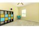 Bedroom with yellow walls, carpet, window with blind, and dark accent furniture at 2351 Kelbrook Ct, Oviedo, FL 32765